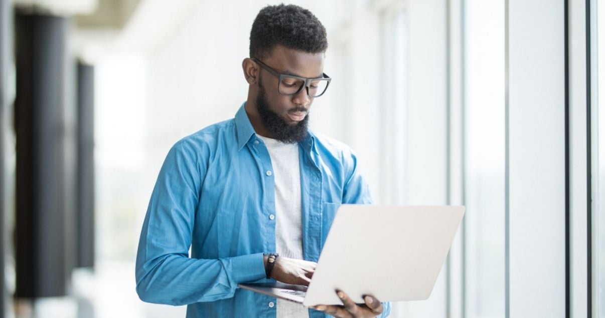 Male office worker reporting on workplace safety through mobile forms