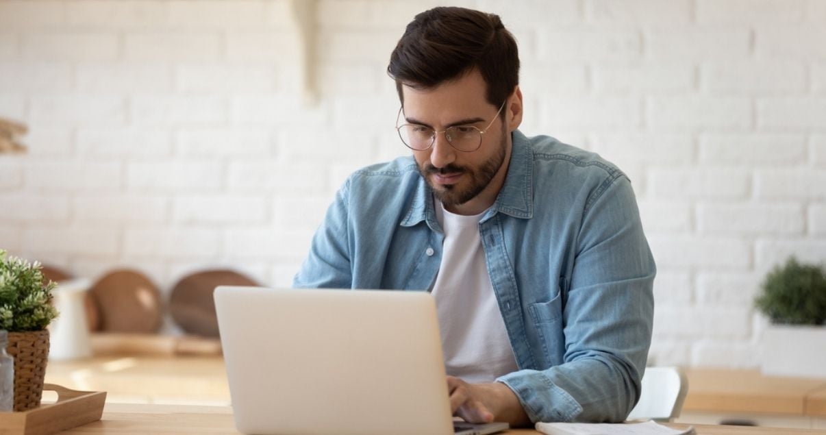 Male worker creating an expense report using mobile forms