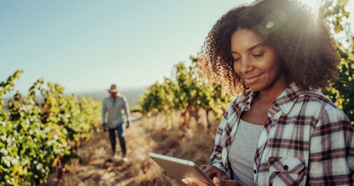 Woman collecting information in the field using Kizeo Forms