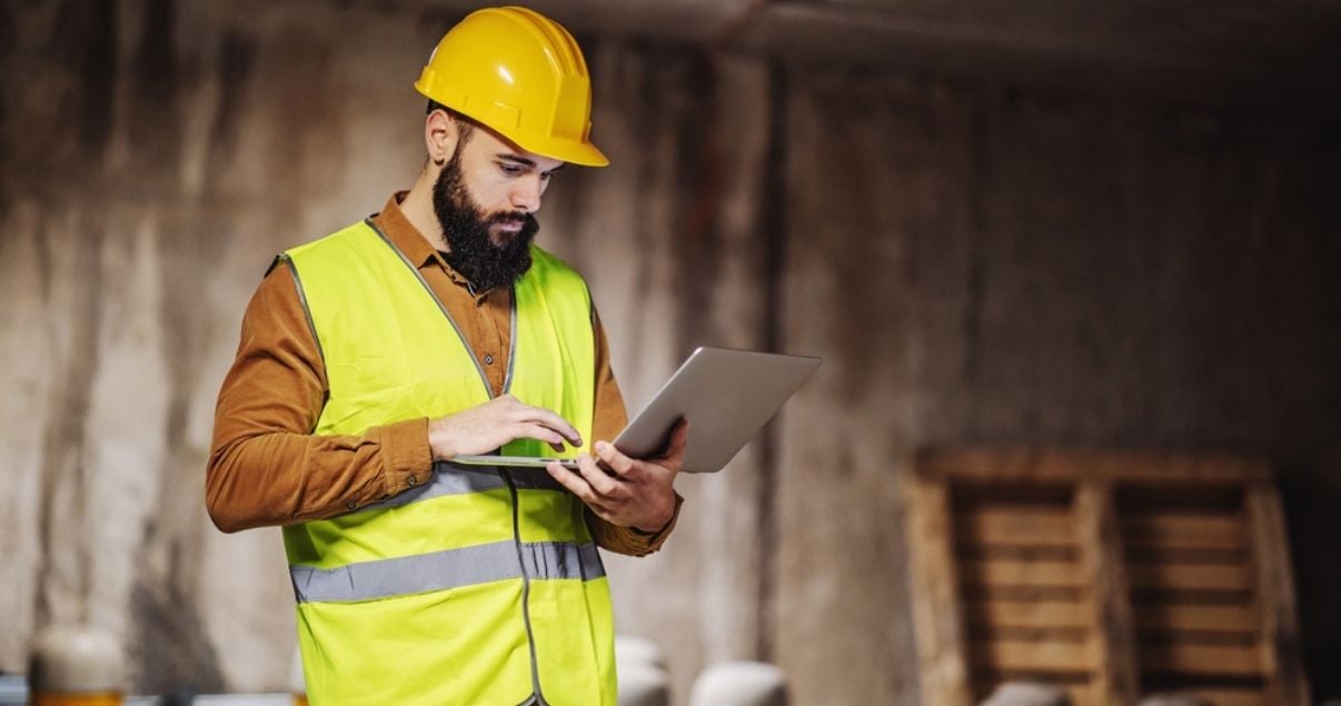 Young construction worker reporting on the risks of his workplace