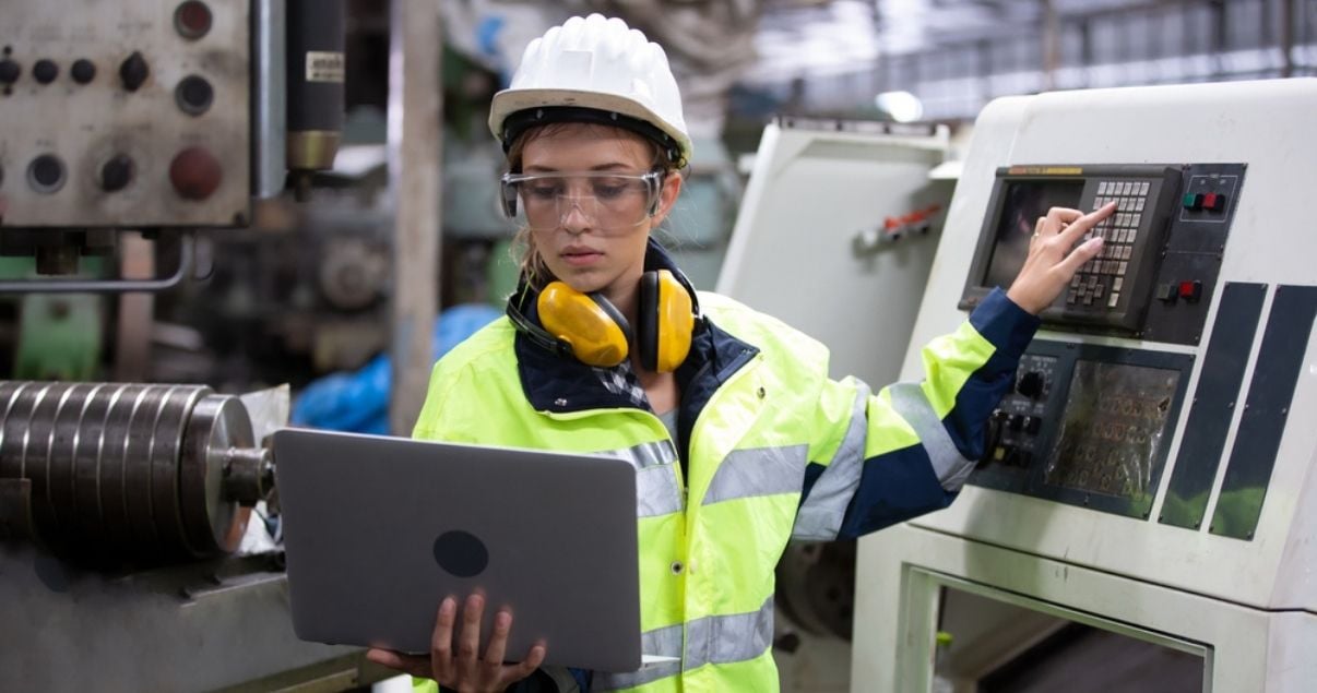 Young female electrician collecting data using Kizeo Forms