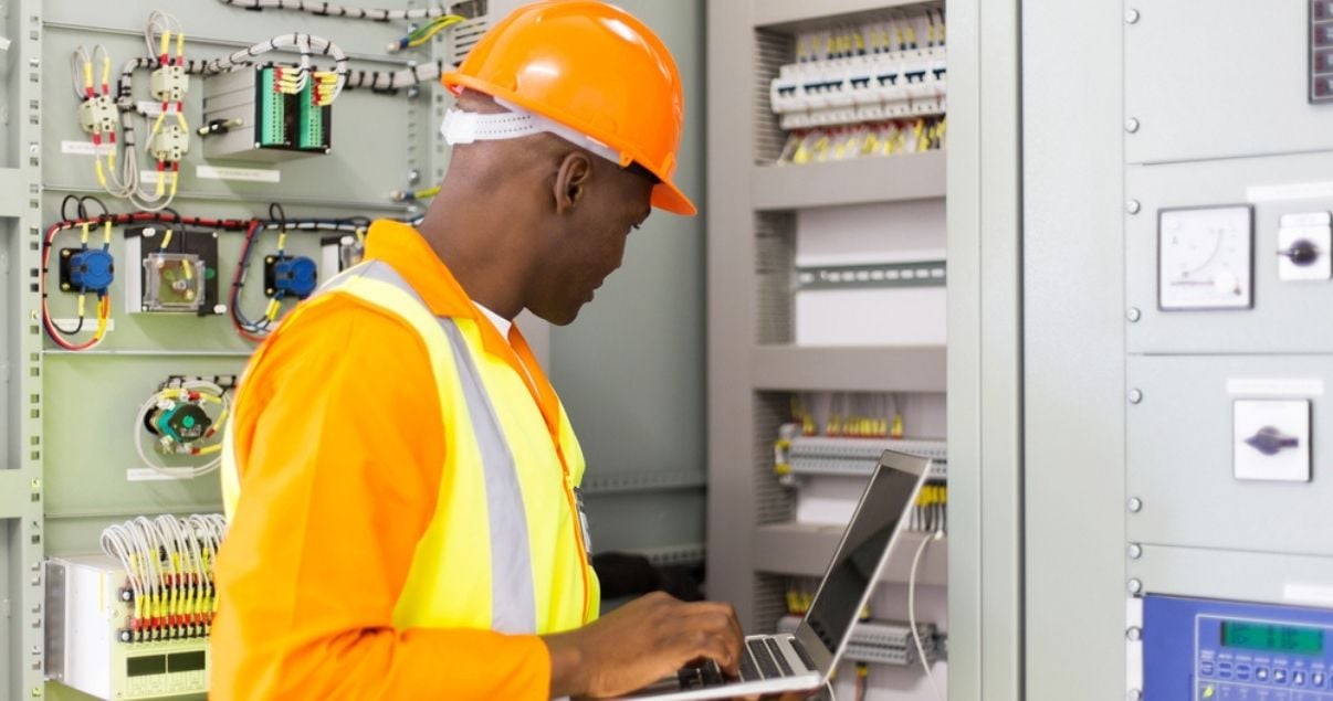 Man checking proper electrical functioning during a building inspection