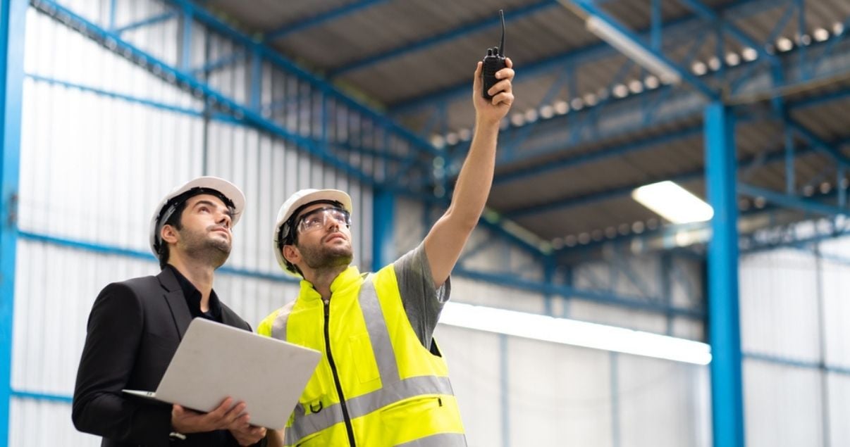 Two men performing a building inspection