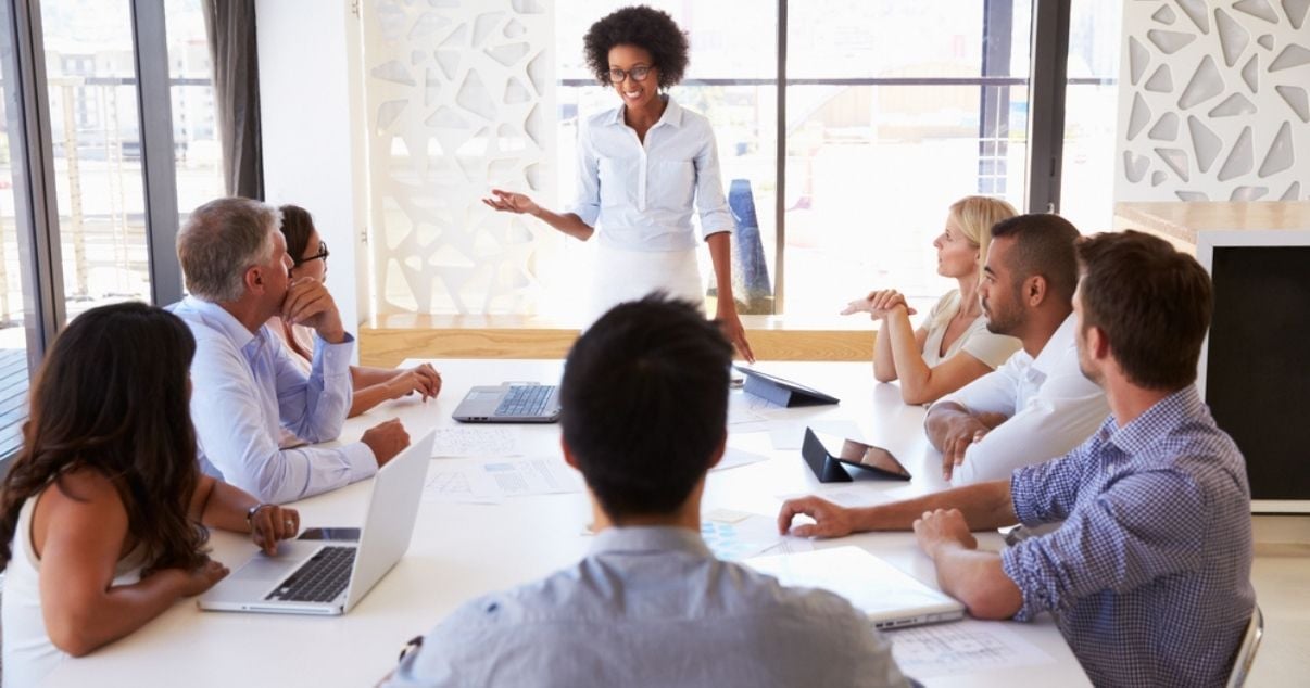 Female businesswoman presenting the benefits of mobile forms to her team