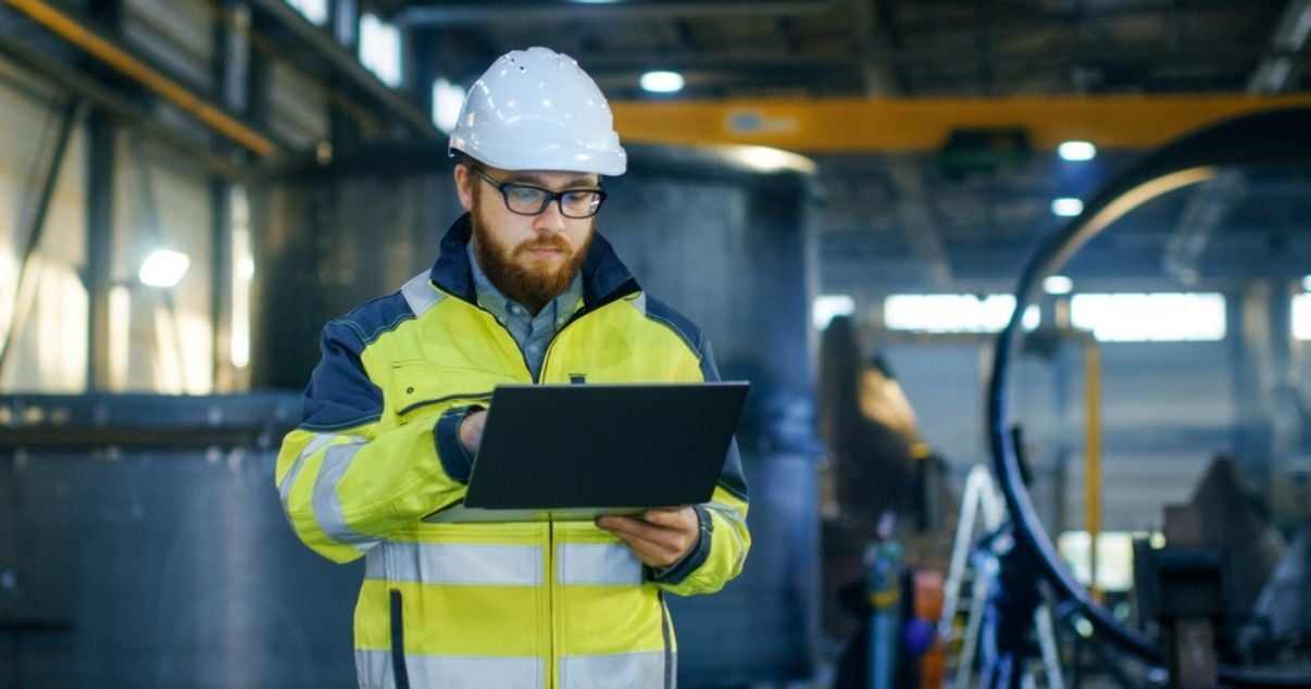 Male engineer collecting data through mobile forms and increaing his organisations productivity consequently