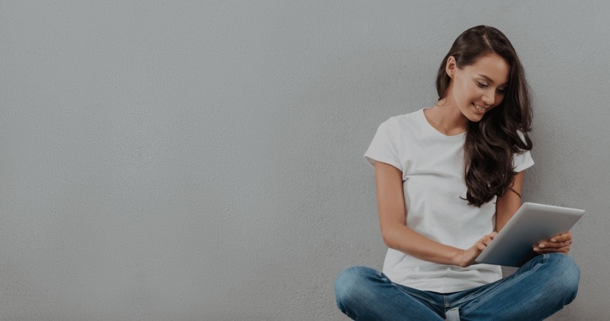 Happy young woman collecting data using Kizeo Forms