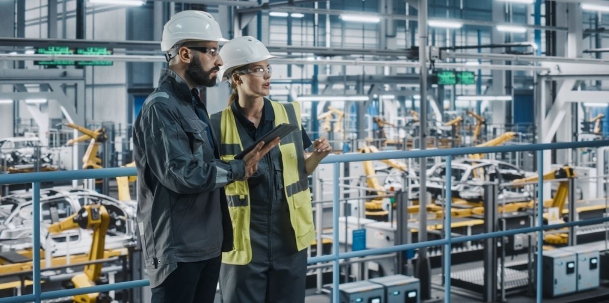 Male and female colleague engineers collecting data through mobile forms